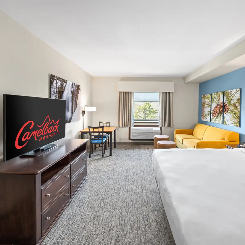 King Bunk Suite living area and king bed